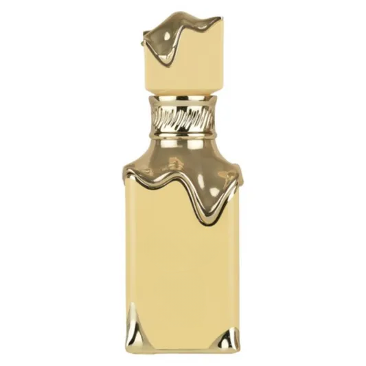 Decorative empty gold-toned bottle with melted wax design, stylish home decor accent