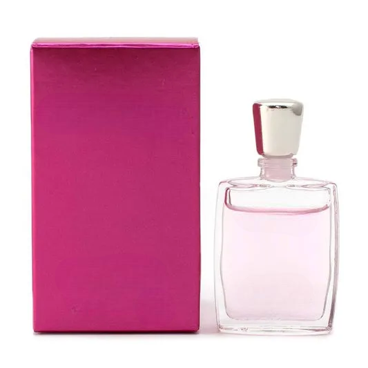 Empty decorative glass bottle with silver cap, pink packaging, home decor accent