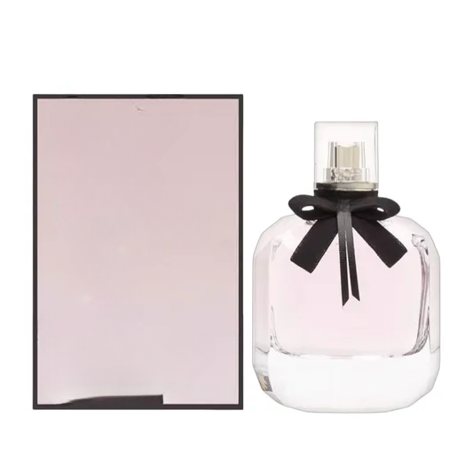 Decorative empty glass perfume bottles with bows, ideal for home decor and styling