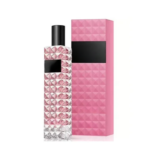 Empty decorative pink geometric glass bottle for home decor, no liquid, standalone display