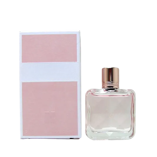 Empty decorative glass bottle with rose gold cap, ideal for home decor, no liquid inside