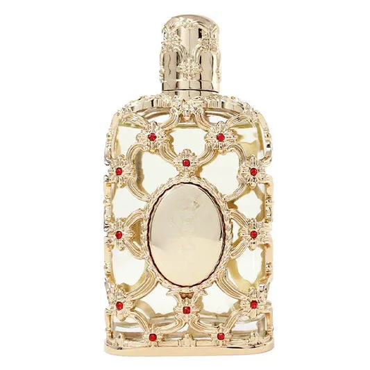 Elegant gold decorative empty bottle with red gem accents, ornate lattice design for home decor