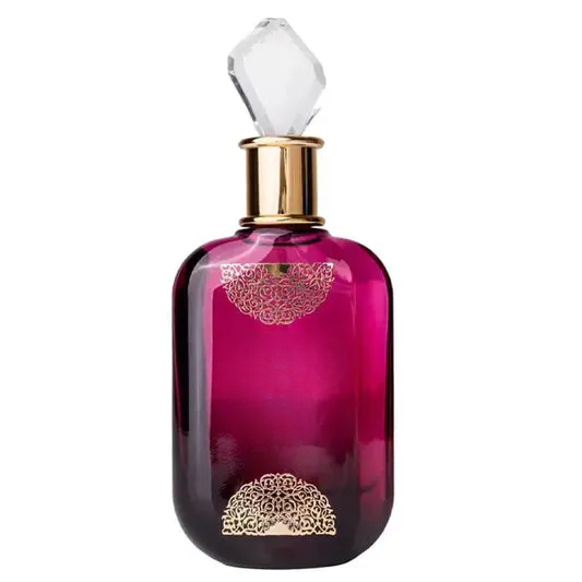 Empty decorative purple glass bottle with gold filigree and crystal stopper for home decor